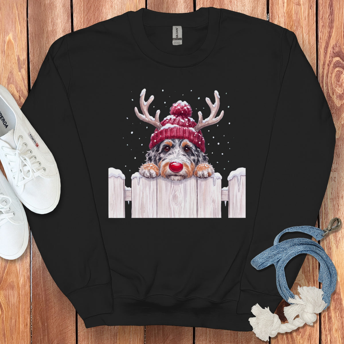 Black sweatshirt with a watercolor-style doodle of a dog in a reindeer hat.