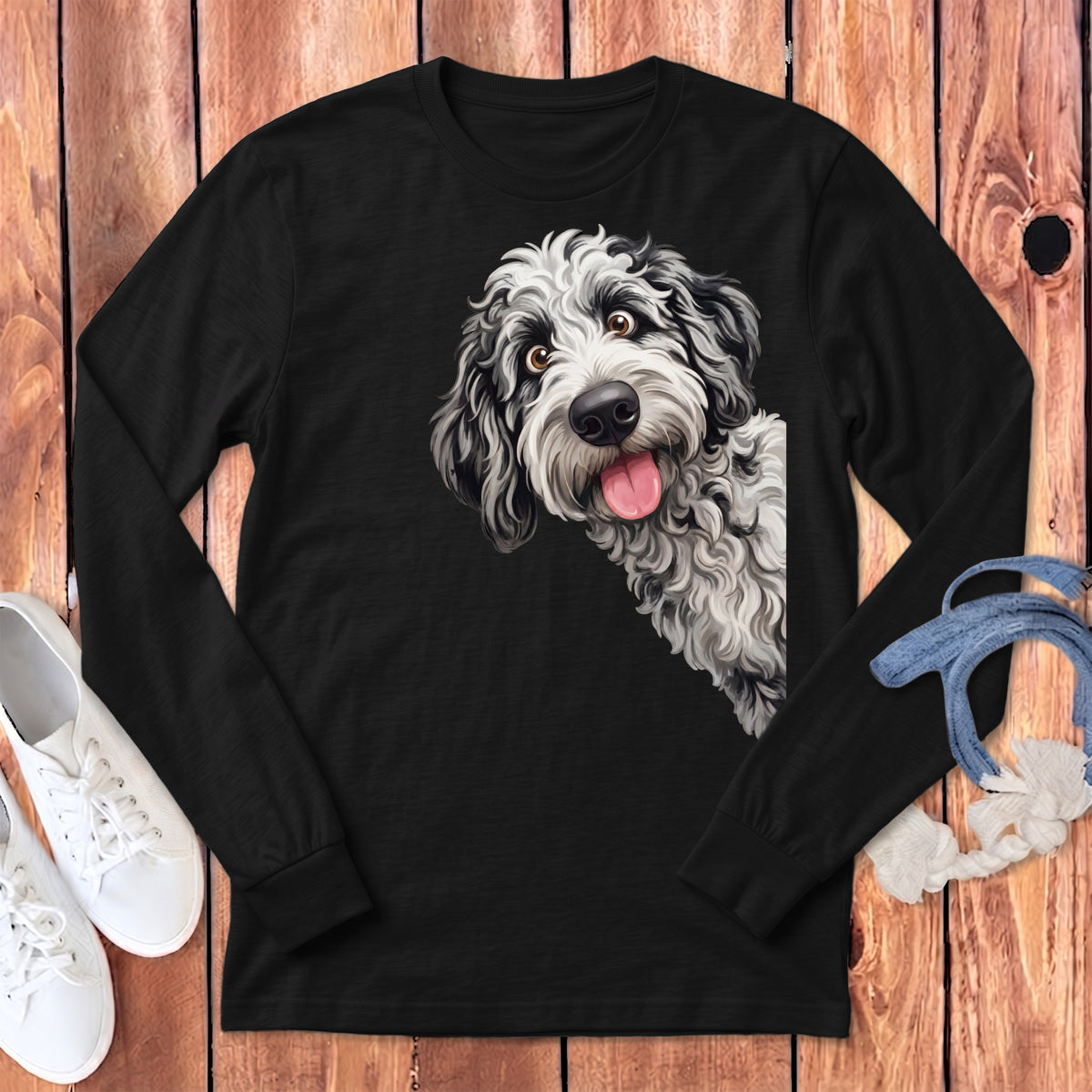 Black long-sleeve shirt with a playful black and white dog graphic on the left chest.