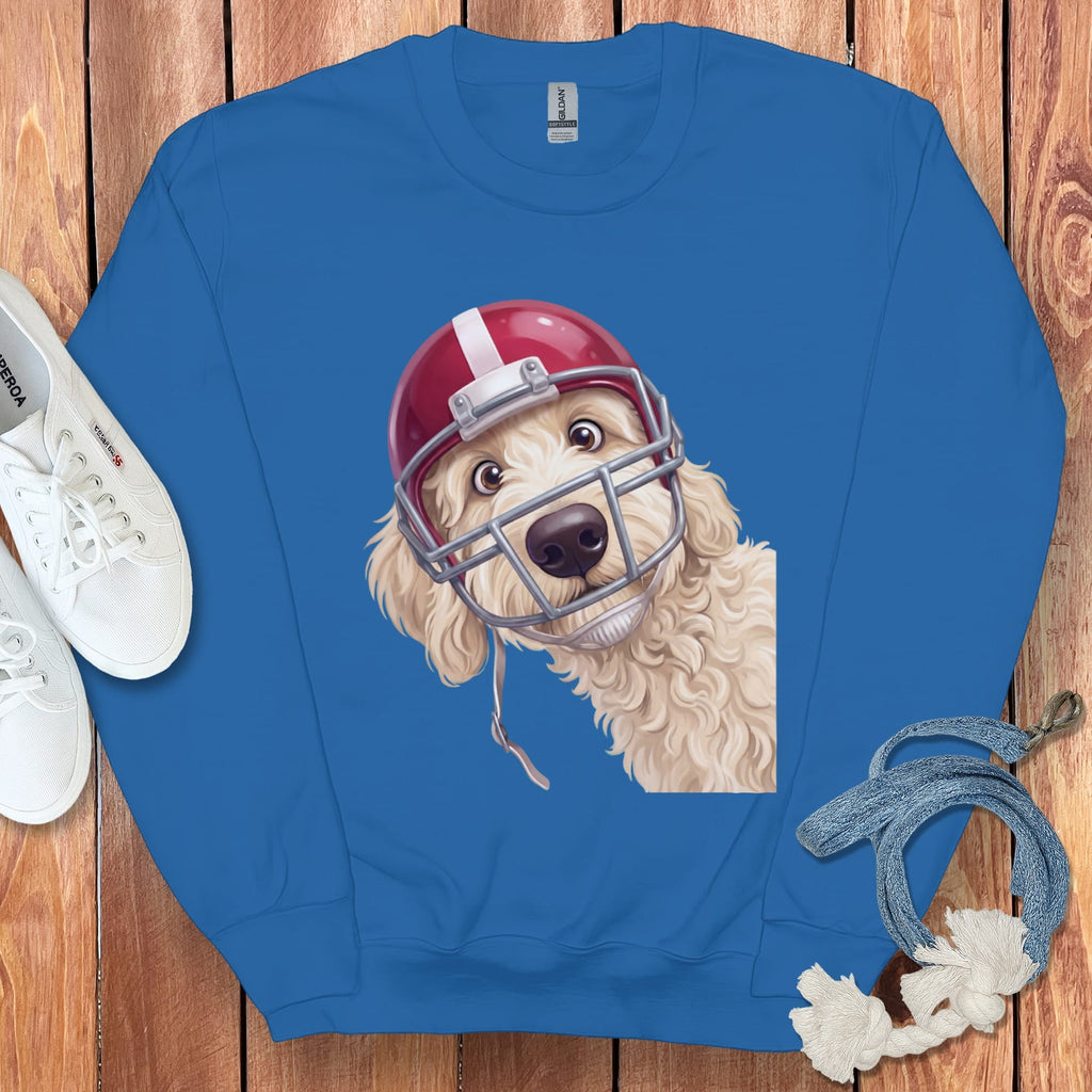 Blue sweatshirt with a cream dog wearing a red football helmet