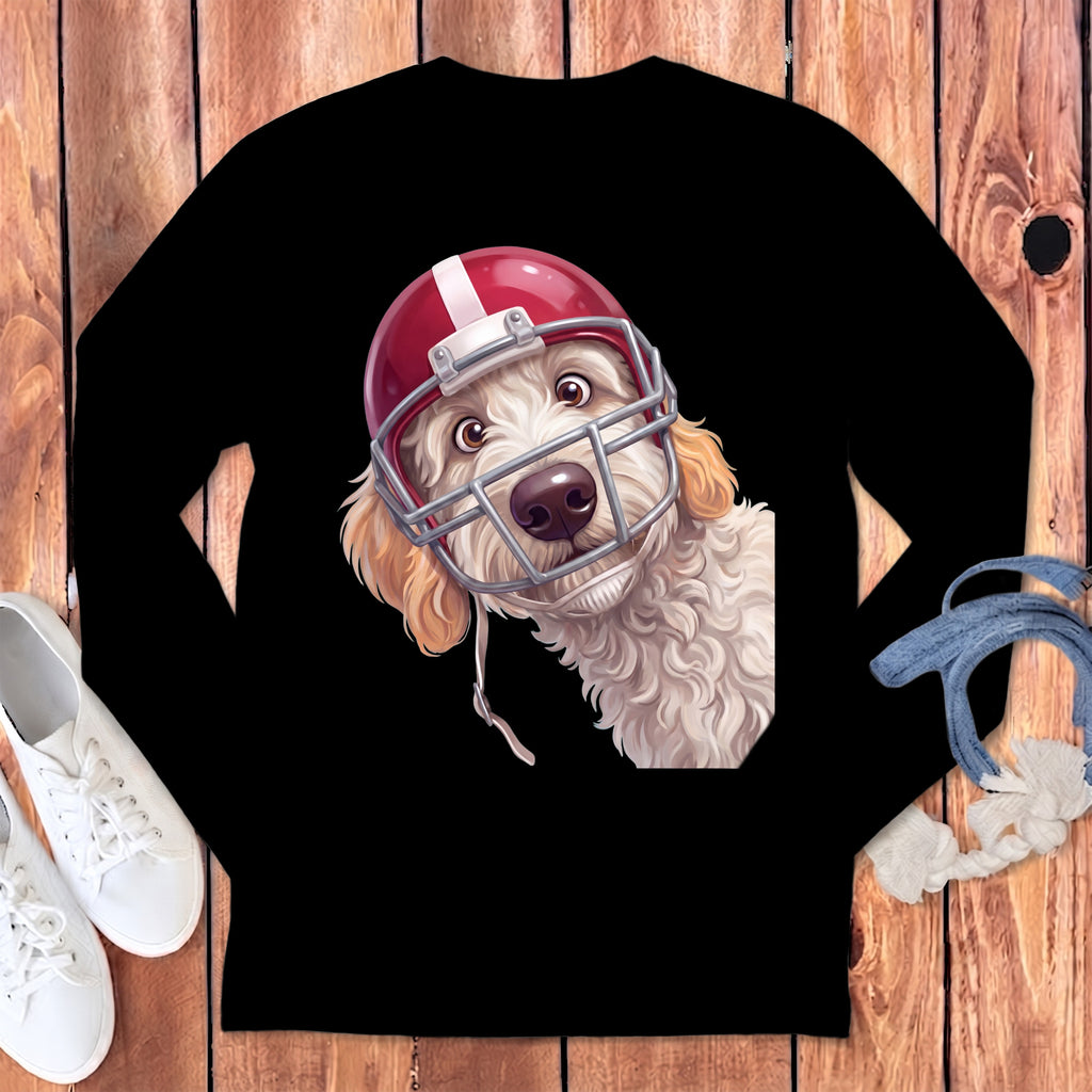 Fluffy dog wearing a red football helmet with a face mask.
