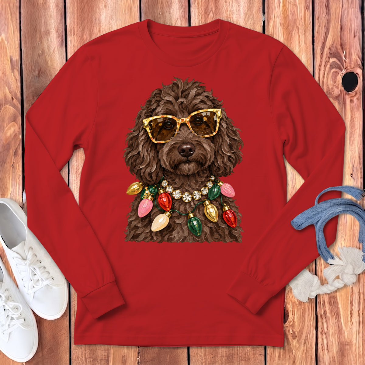 Brown dog wearing sunglasses and a string of Christmas lights.