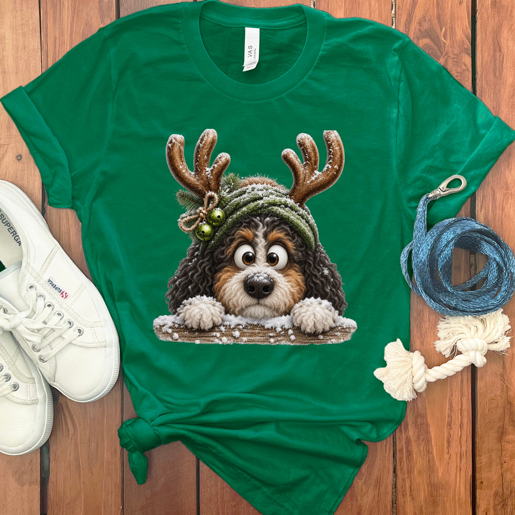 Green t-shirt with a Bernese Mountain Dog wearing reindeer antlers and a winter hat.