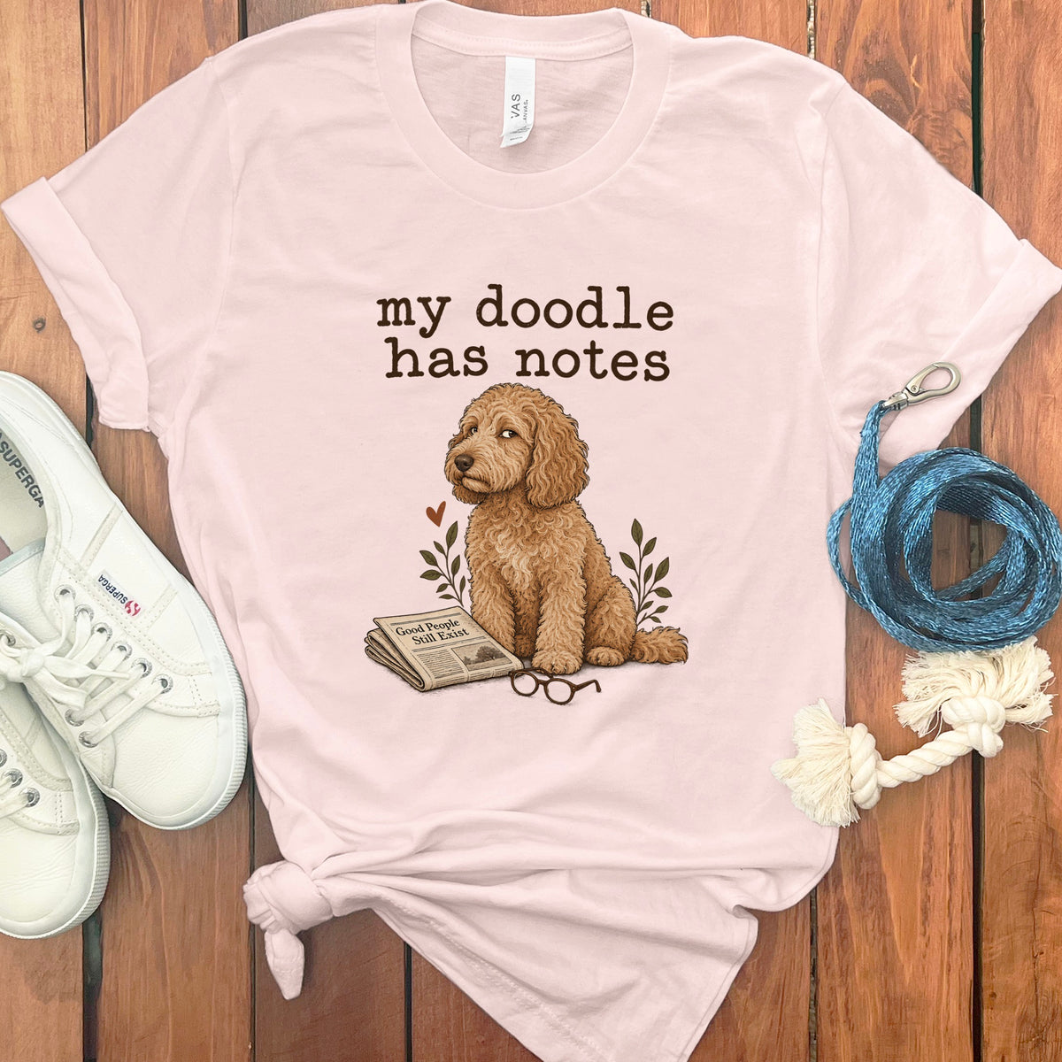 Light pink t-shirt with doodle dog graphic and text "my doodle has notes"