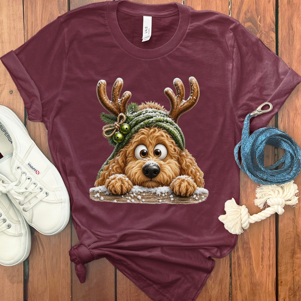 Maroon t-shirt with cartoon dog wearing antlers, green hat, and bells.