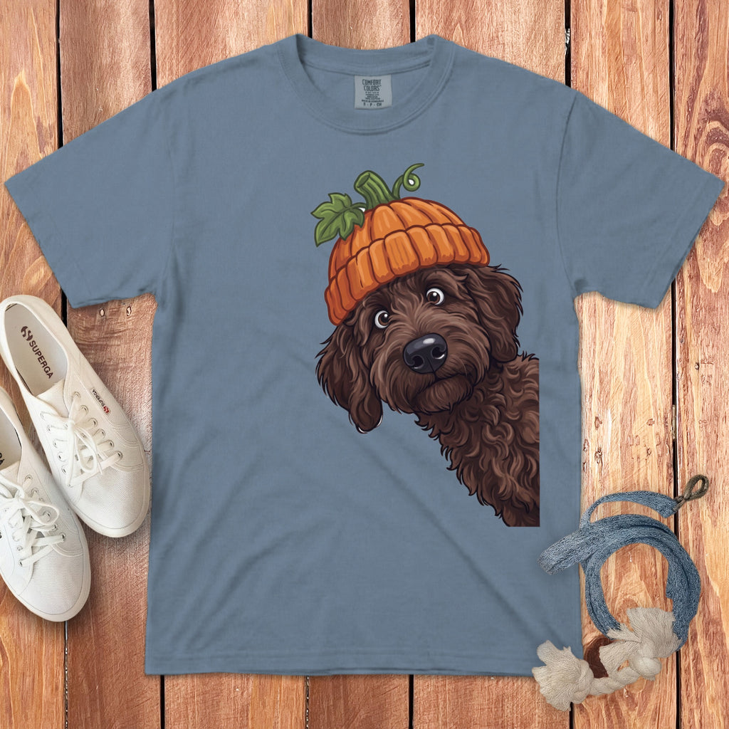 T-shirt with a brown dog wearing a pumpkin hat and white sneakers.