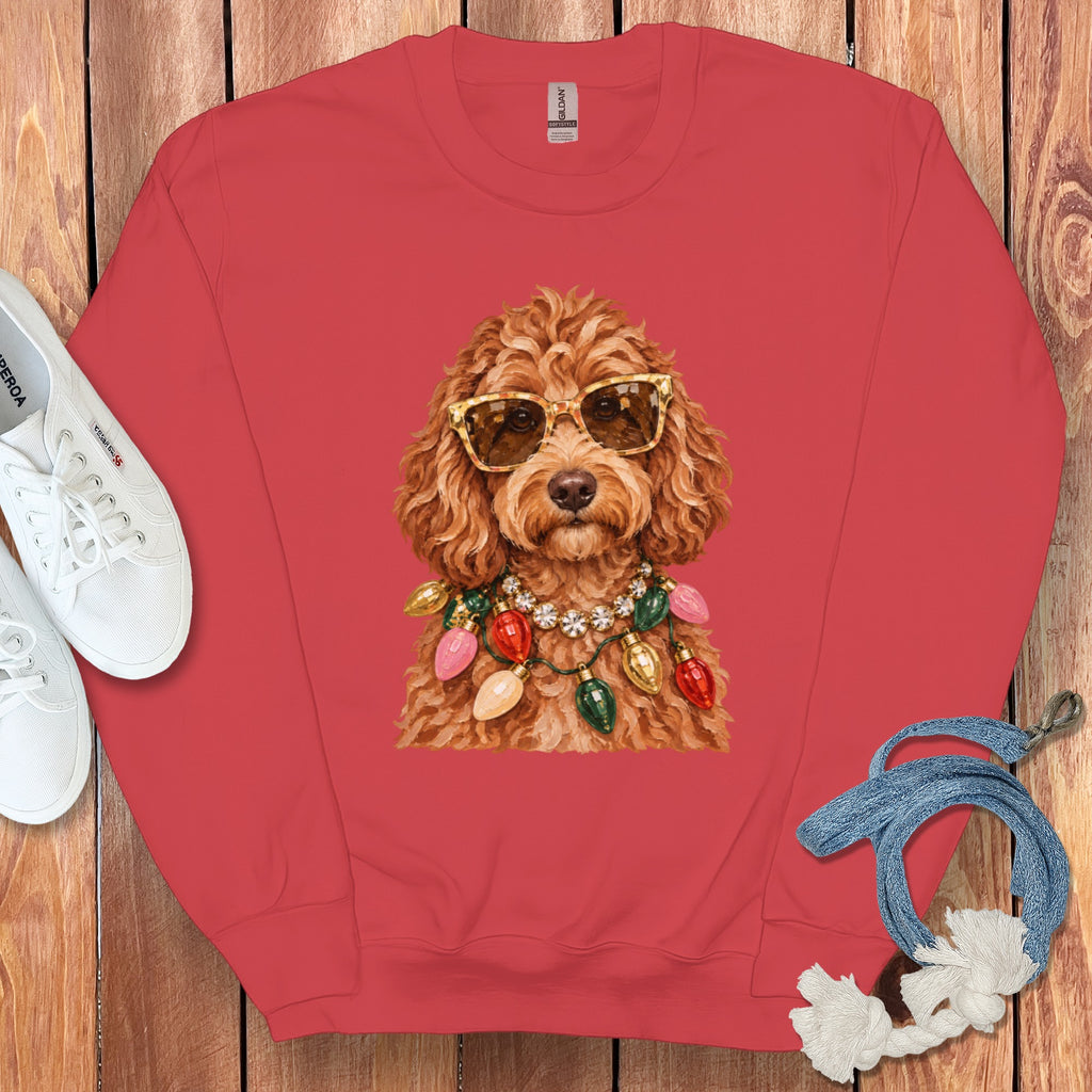 Coral sweatshirt with a watercolor illustration of a dog wearing sunglasses and Christmas lights.