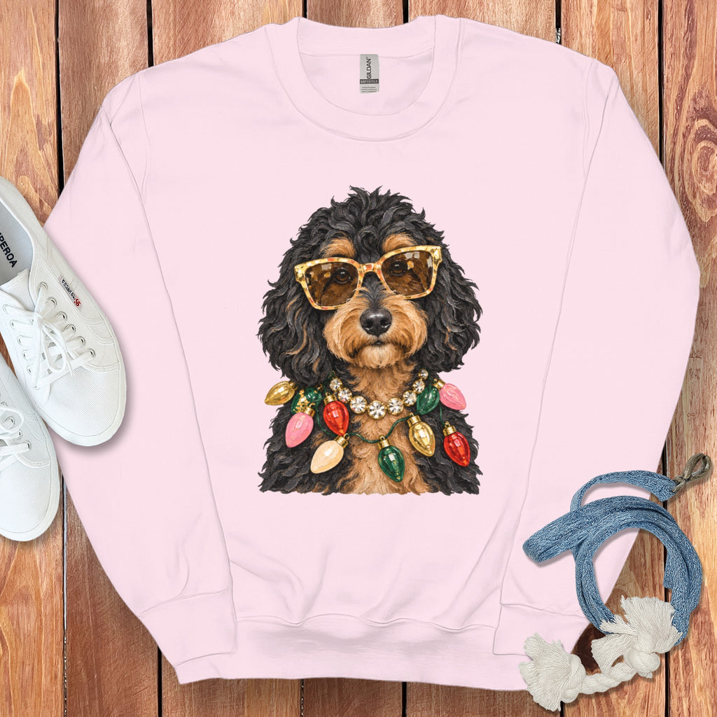 Pink sweatshirt featuring a dog wearing sunglasses and a Christmas lights necklace.
