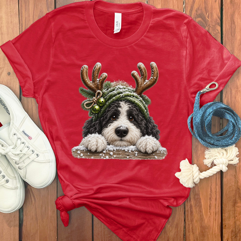 Red t-shirt with a dog wearing a green knit hat with antlers and jingle bells.