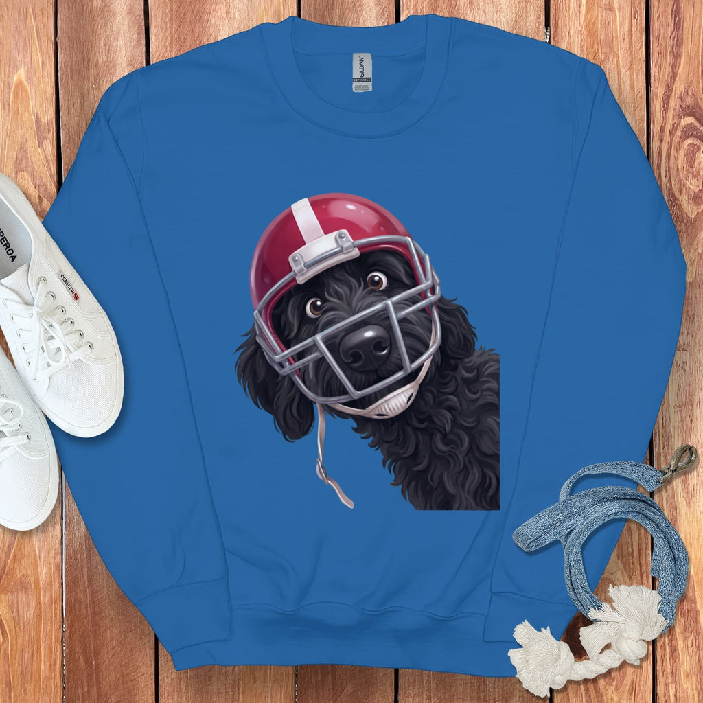 Blue sweatshirt featuring a black dog wearing a red football helmet and face mask.