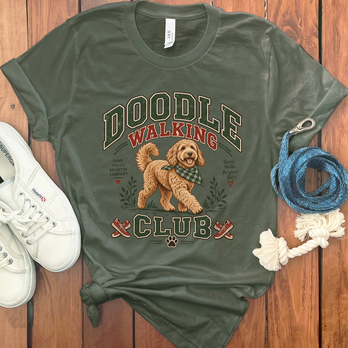 Green t-shirt with "Doodle Walking Club" text and a goldendoodle graphic.
