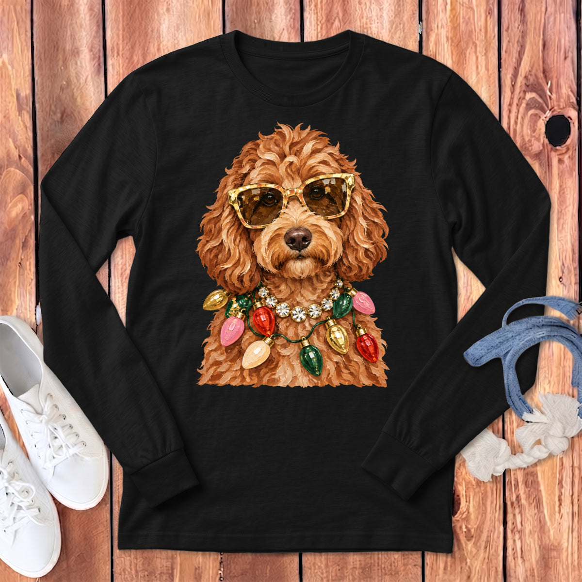 Brown poodle wearing gold sunglasses and colorful Christmas lights necklace.