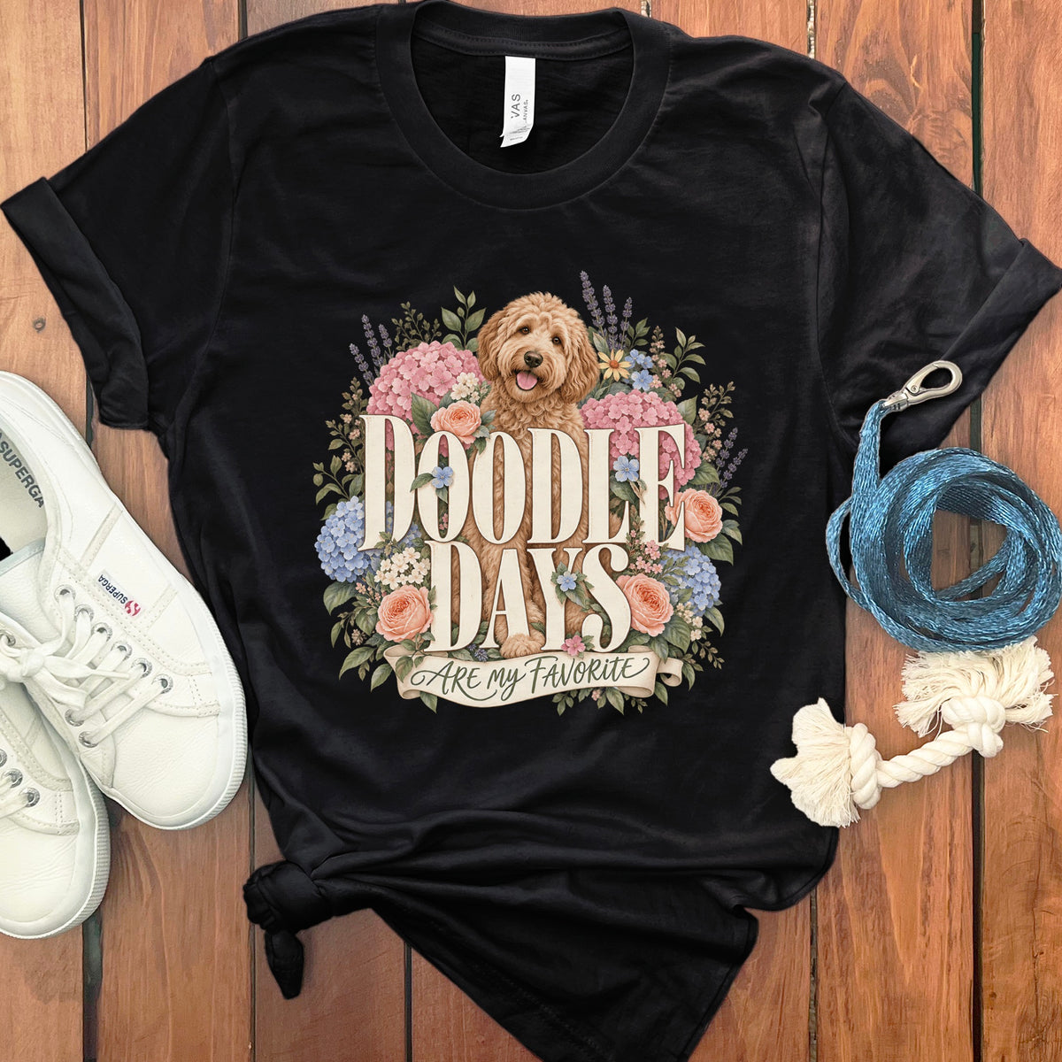 Black t-shirt with a doodle dog and flowers. Text reads "Doodle Days Are my Favorite".