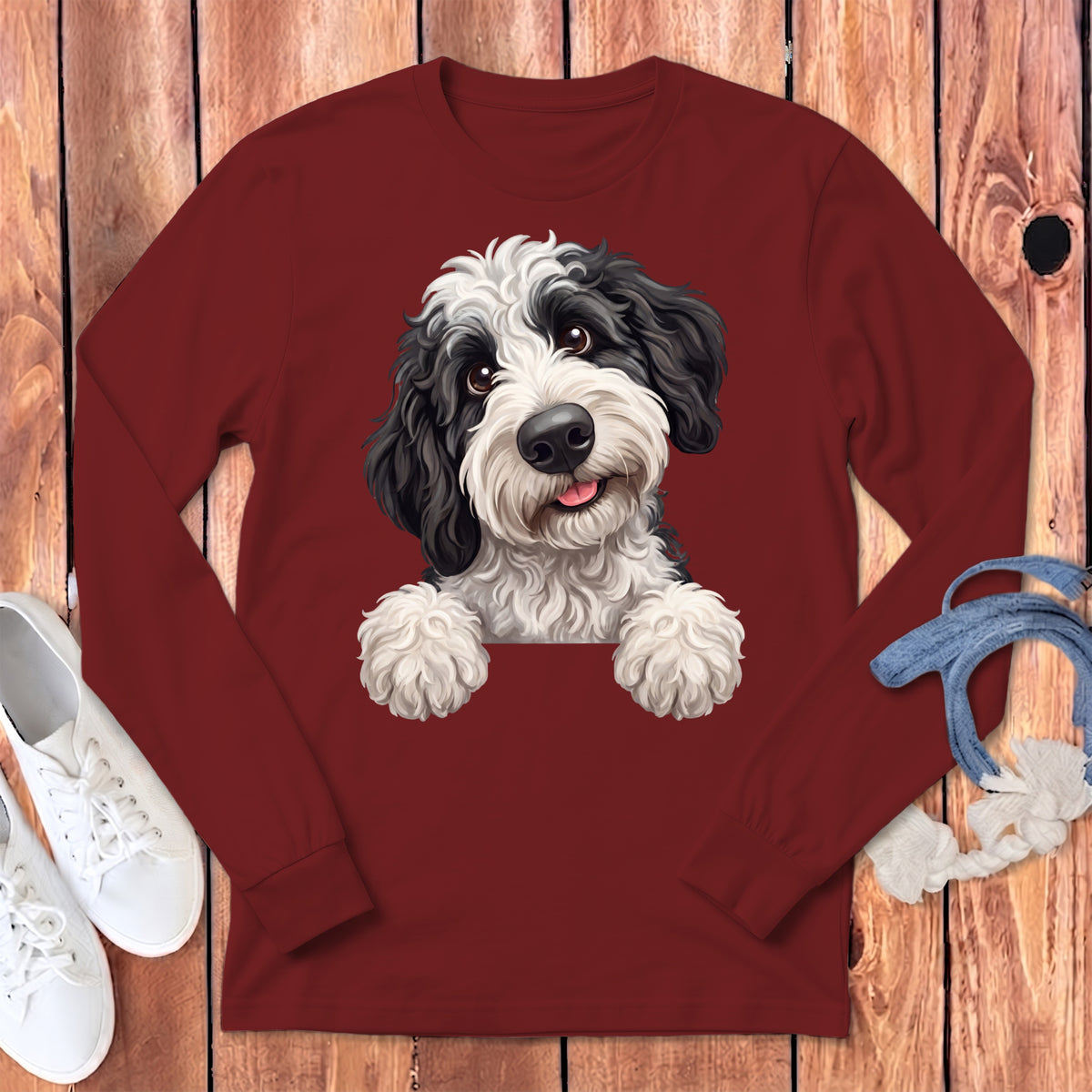 Long sleeve maroon t-shirt with a black and white fluffy dog design.