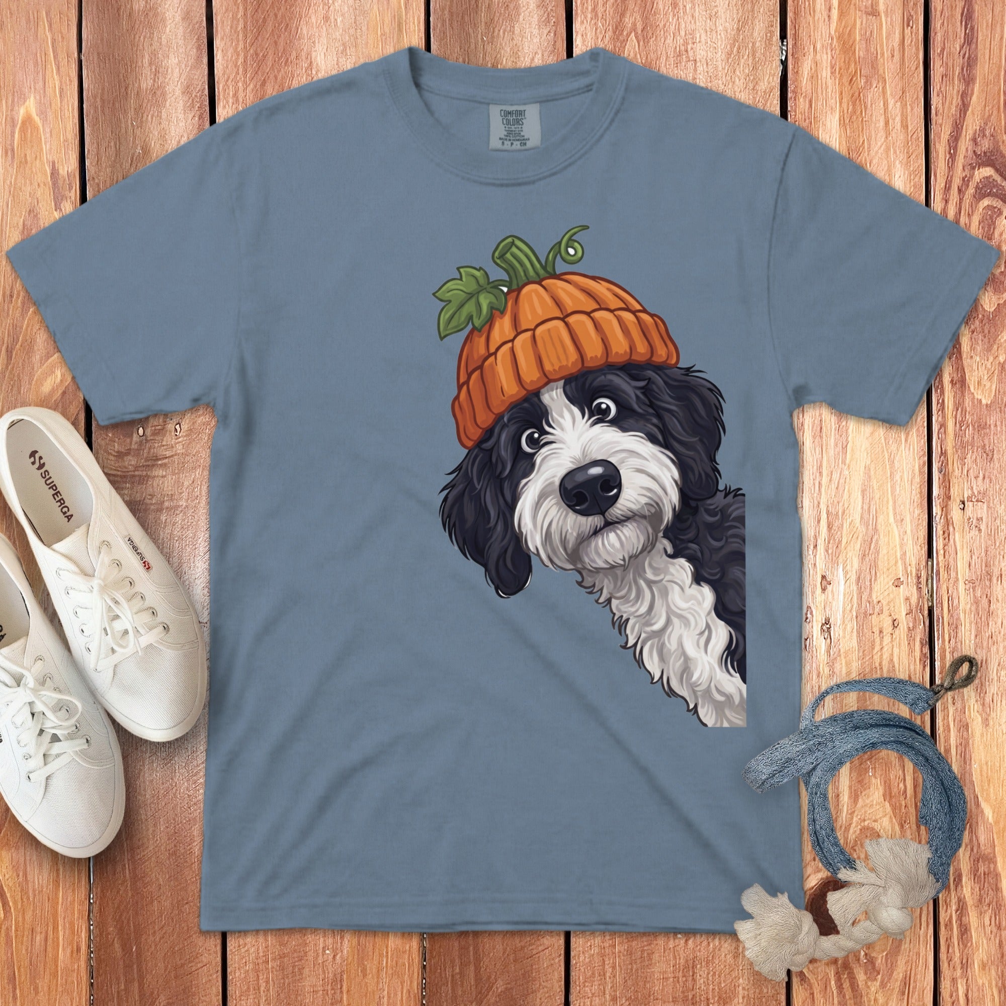 Blue t-shirt with a black and white dog wearing a pumpkin hat.
