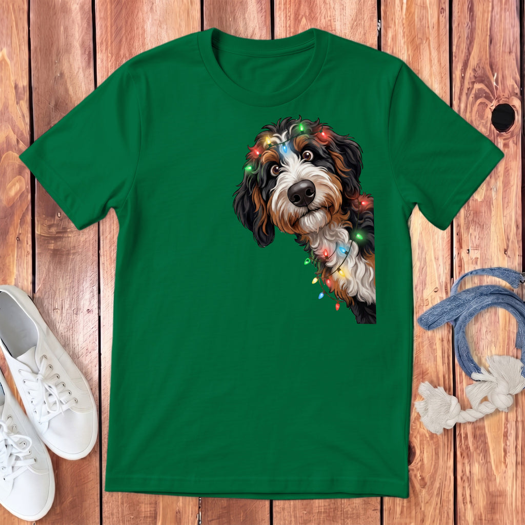 Green t-shirt with a Bernese Mountain Dog wearing Christmas lights.