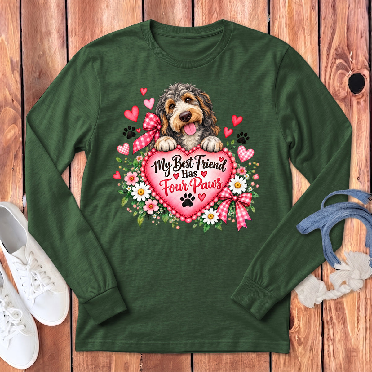 Dark green long-sleeved shirt with a puppy graphic holding a pink heart that reads My Best Friend Has Four Paws.
