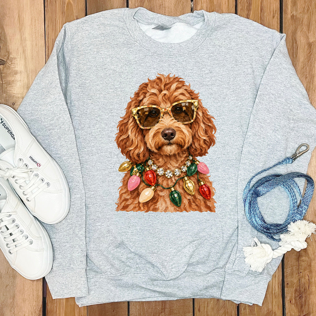 Light gray sweatshirt with illustration of a dog wearing sunglasses and Christmas lights.