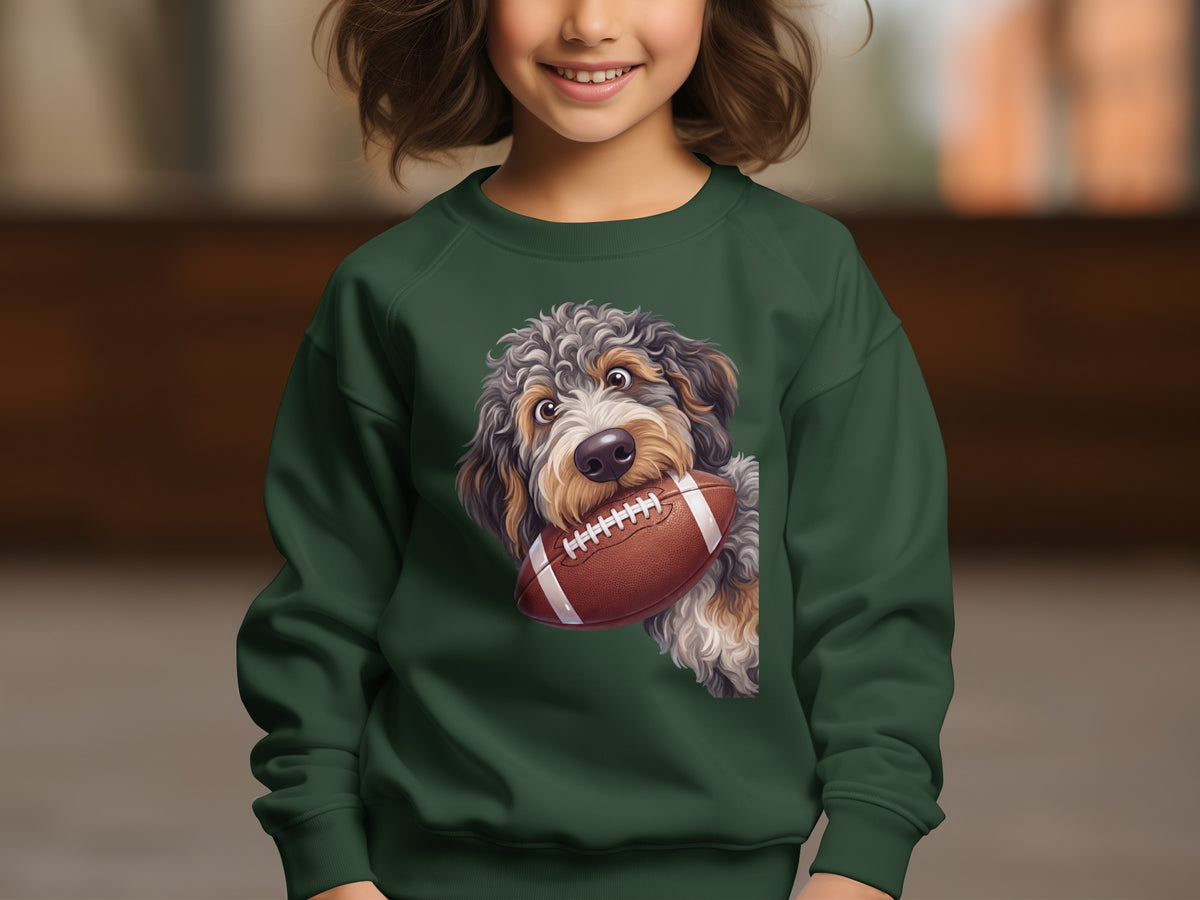 Green sweatshirt with a doodle dog holding a football.