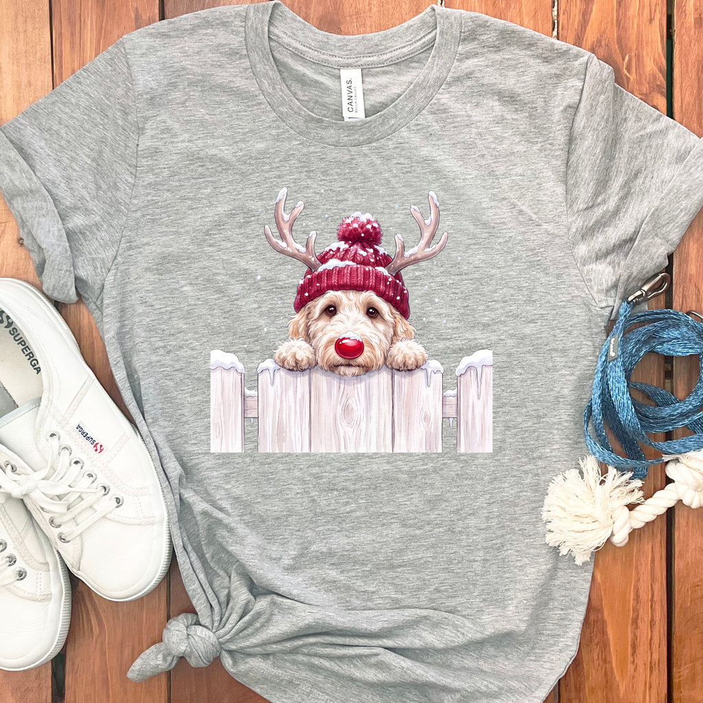Grey t-shirt with graphic of a golden doodle wearing a red hat with antlers.