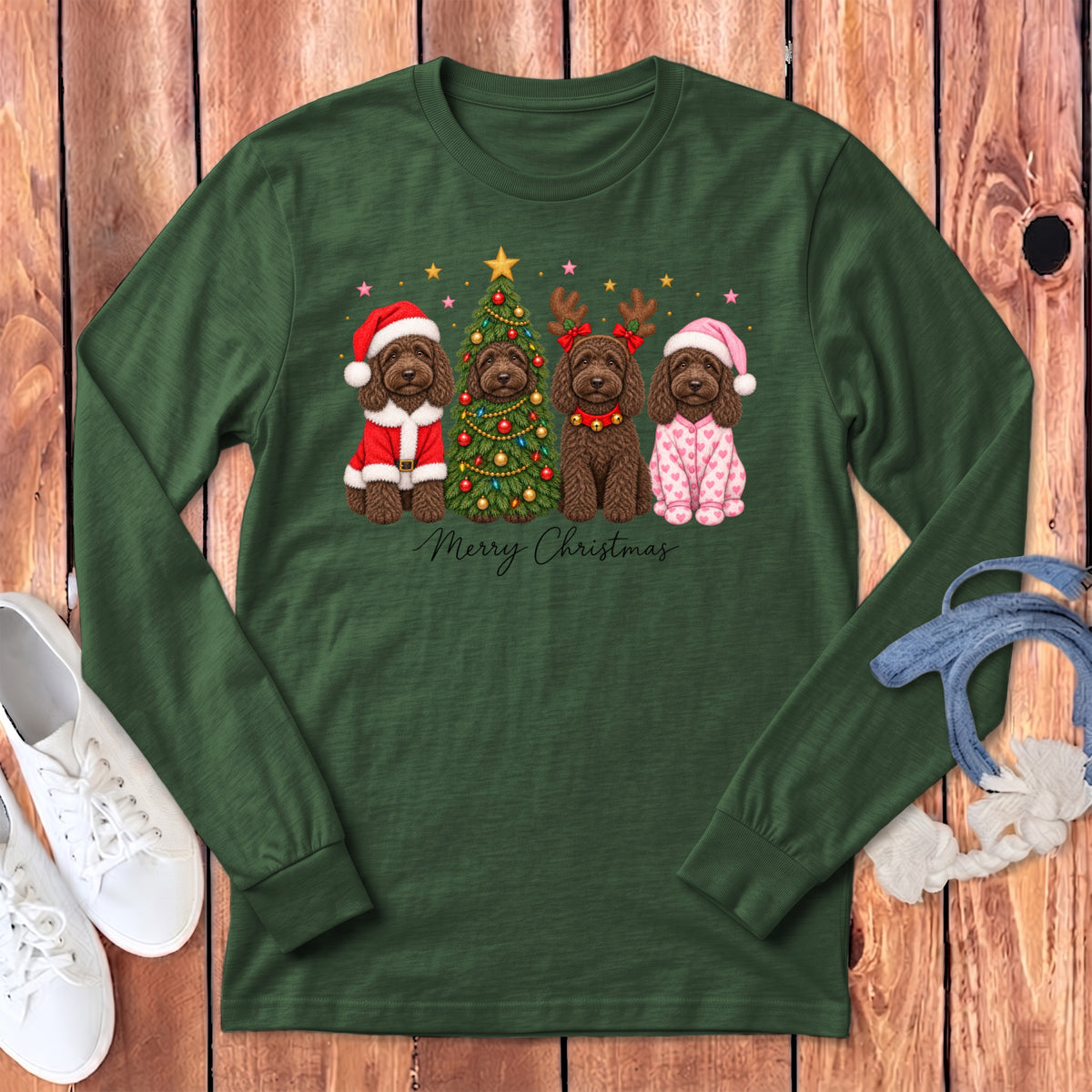Dark green long-sleeve t-shirt featuring a Christmas graphic of four brown doodle dogs and a decorated tree.
