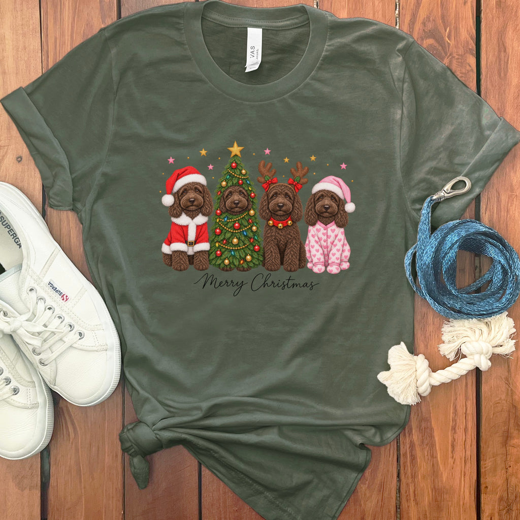 Olive green t-shirt featuring a Christmas graphic of four brown dogs, surrounded by sneakers and rope.