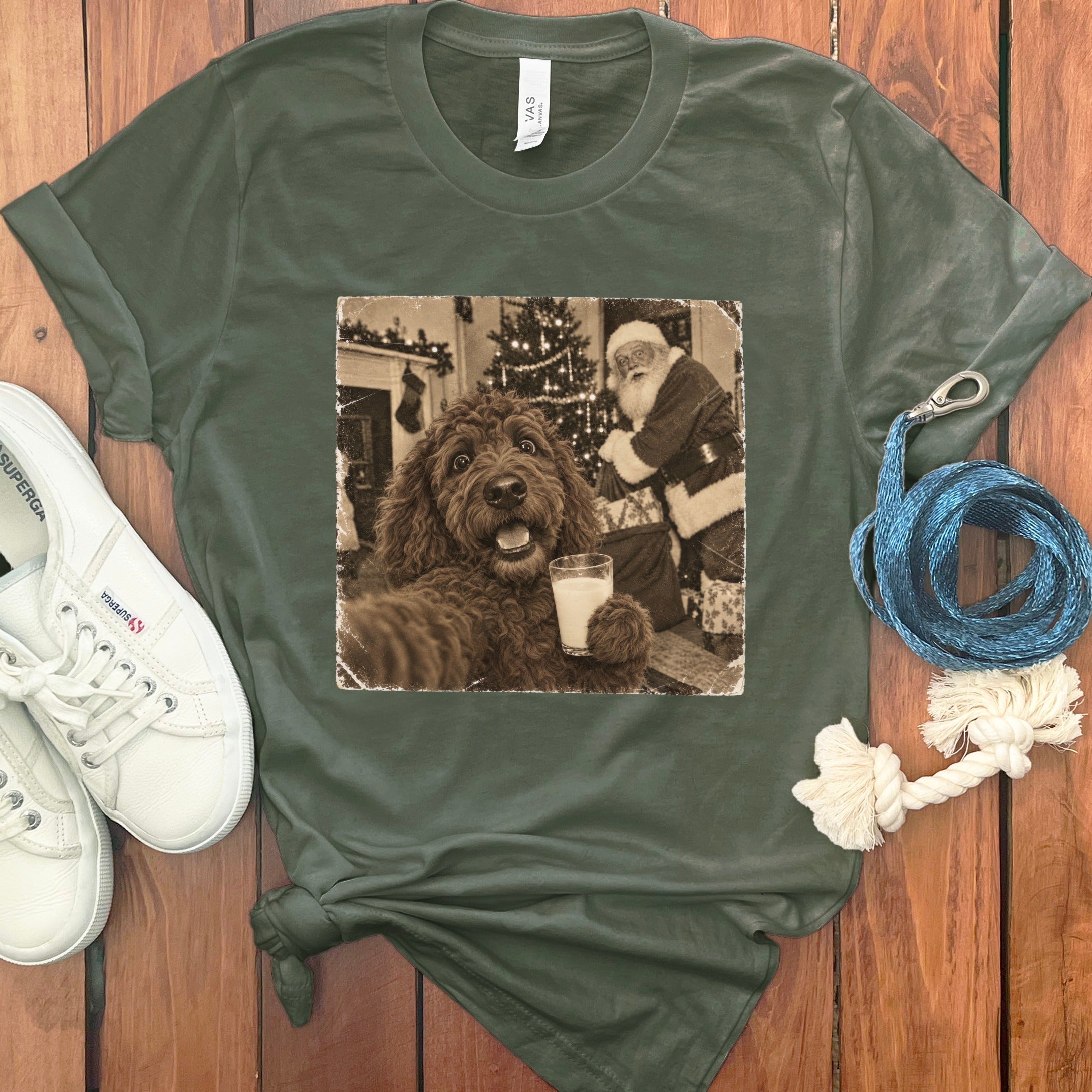 Dark green crewneck t-shirt featuring a retro graphic of a brown doodle holding a glass of milk with Santa Claus in the background.