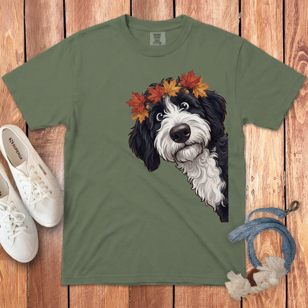 Green t-shirt with a black and white dog wearing a fall leaf crown.
