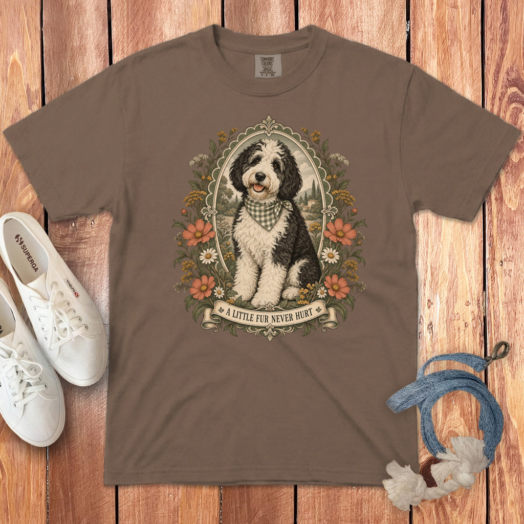 A brown t-shirt featuring a framed graphic of a black and white dog wearing a checkered bandana.