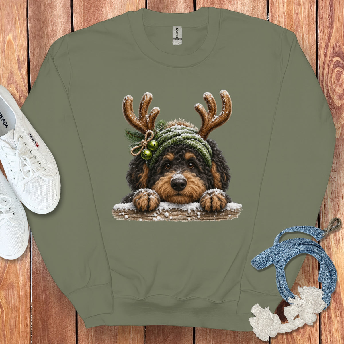 Crewneck sweatshirt with a doodle dog wearing antlers and a festive hat.