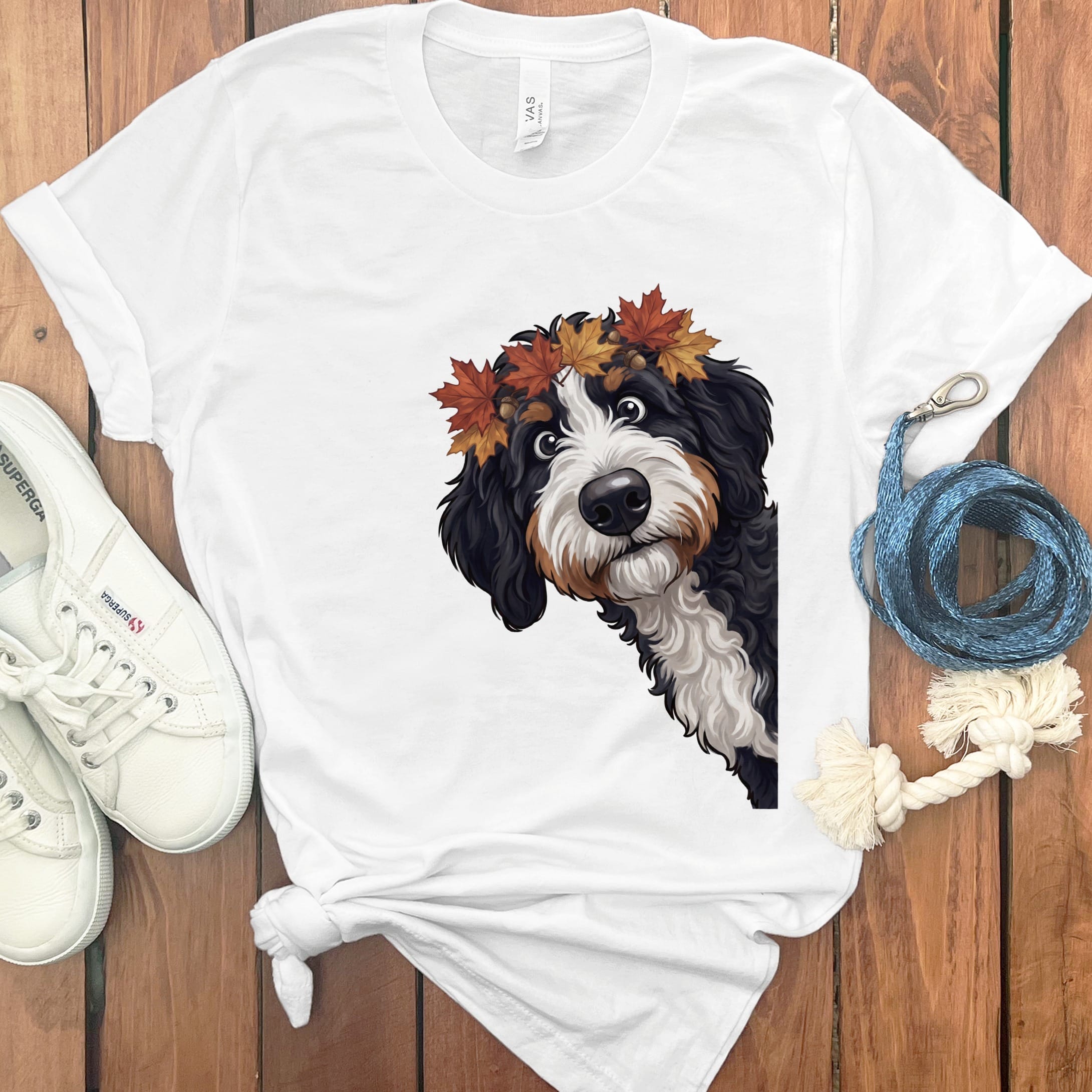 White t-shirt with a Bernese Mountain Dog wearing an autumn leaf crown.