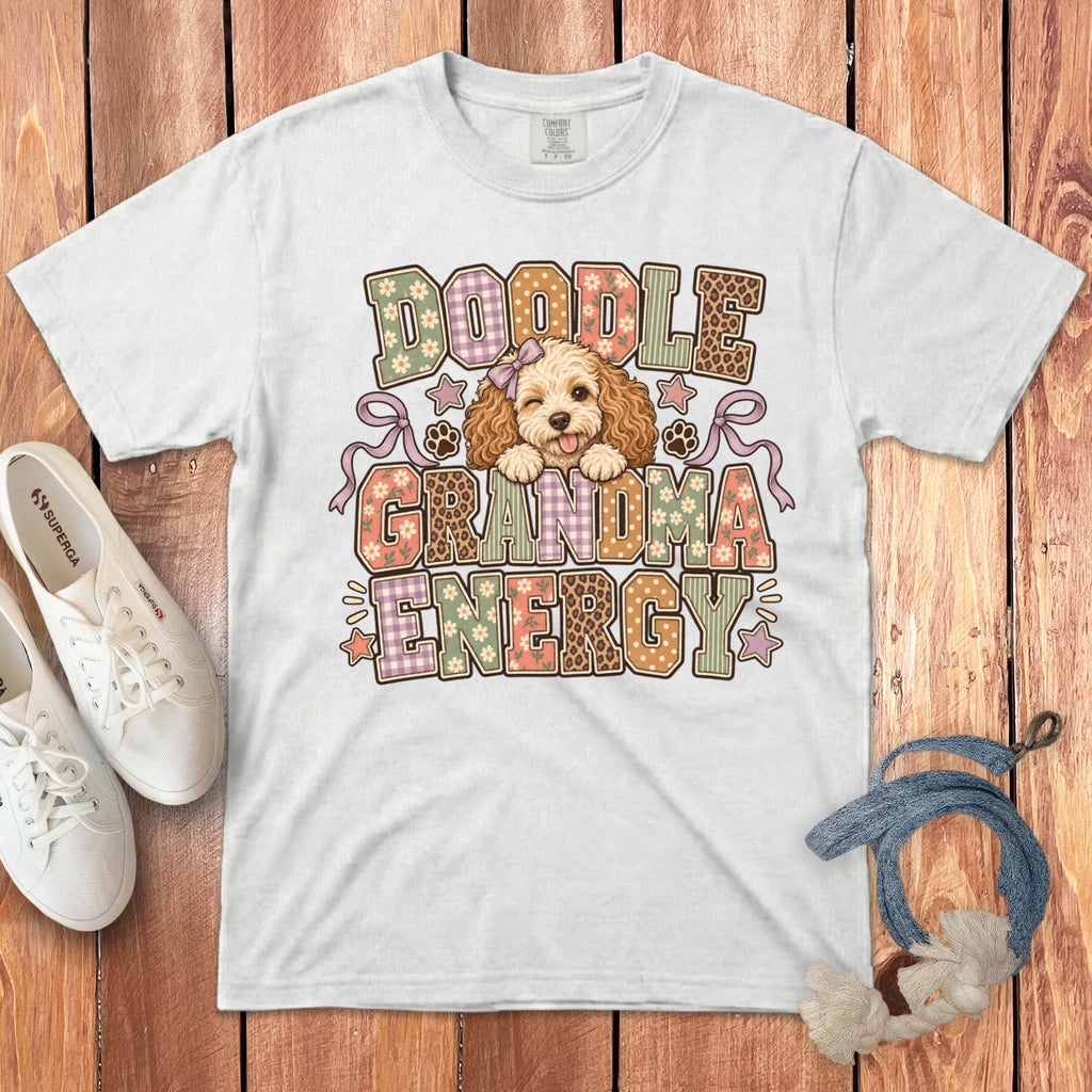 White t-shirt with a Doodle Grandma Energy graphic, featuring a cartoon dog and patterned text.