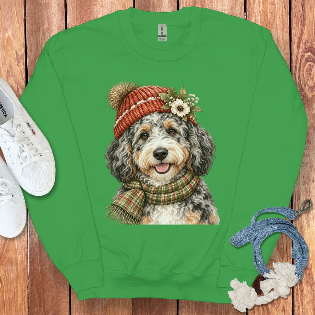 Green sweatshirt with a cartoon dog wearing a festive hat and scarf.
