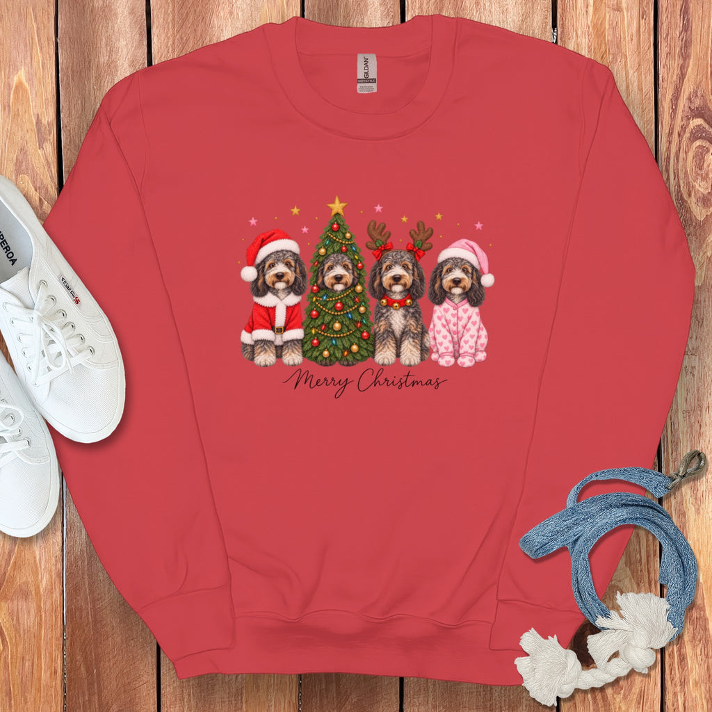 A red crewneck sweatshirt with a Christmas graphic of four dogs, a tree, and Merry Christmas text.