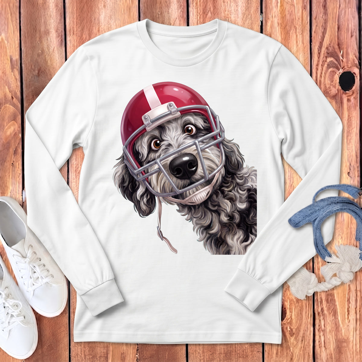 White long-sleeve shirt featuring a doodle dog wearing a football helmet.