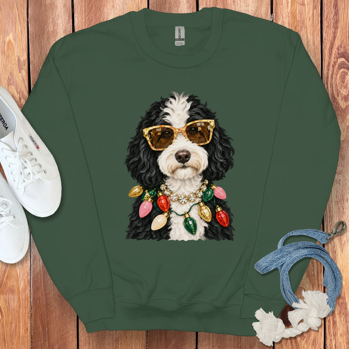 Green sweatshirt with a dog wearing sunglasses and a string of Christmas lights.