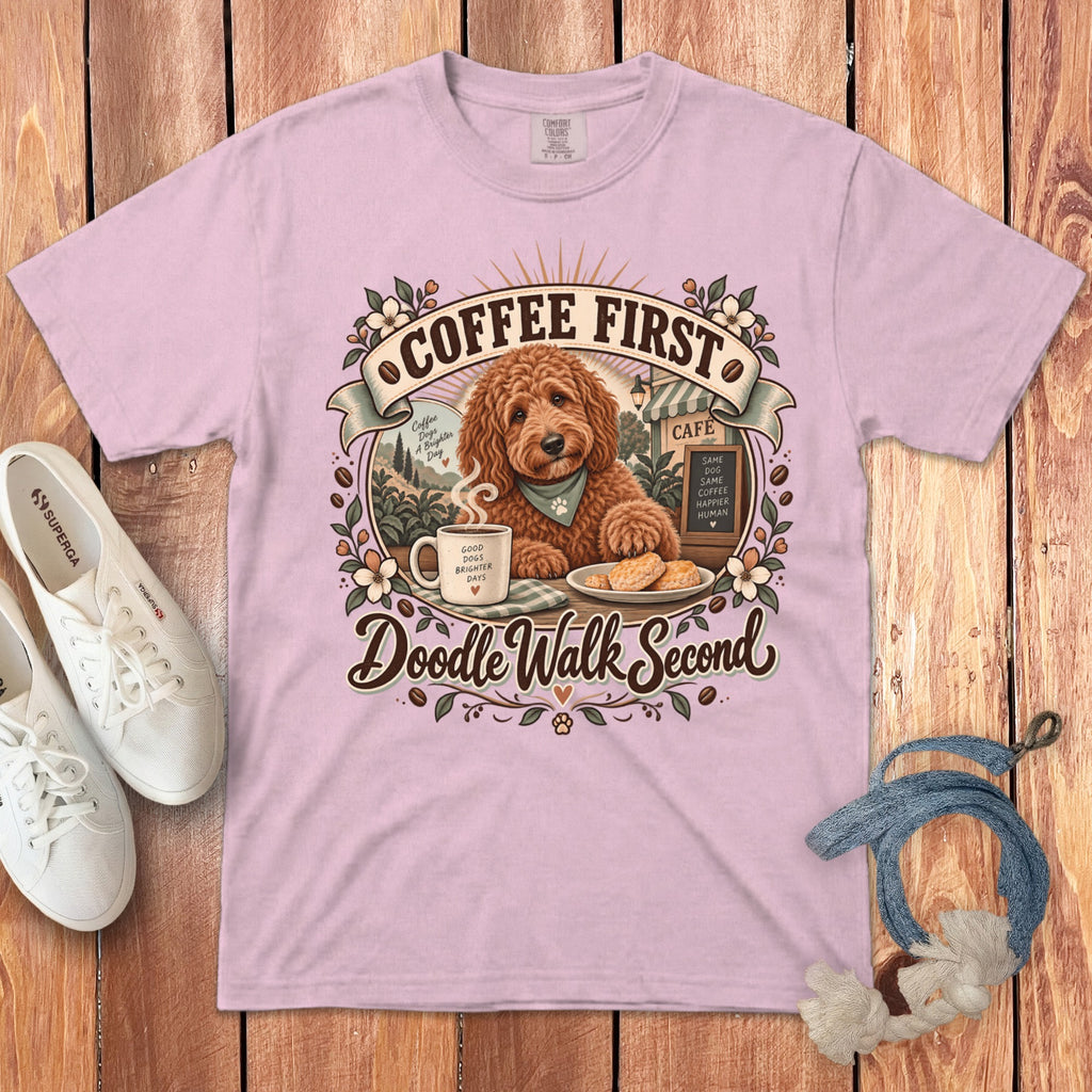 Pink t-shirt with a doodle, coffee mug, cookies, and "Coffee First, Doodle Walk Second" text.