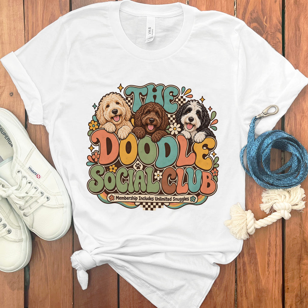 White t-shirt with "The Doodle Social Club" graphic and three doodles.