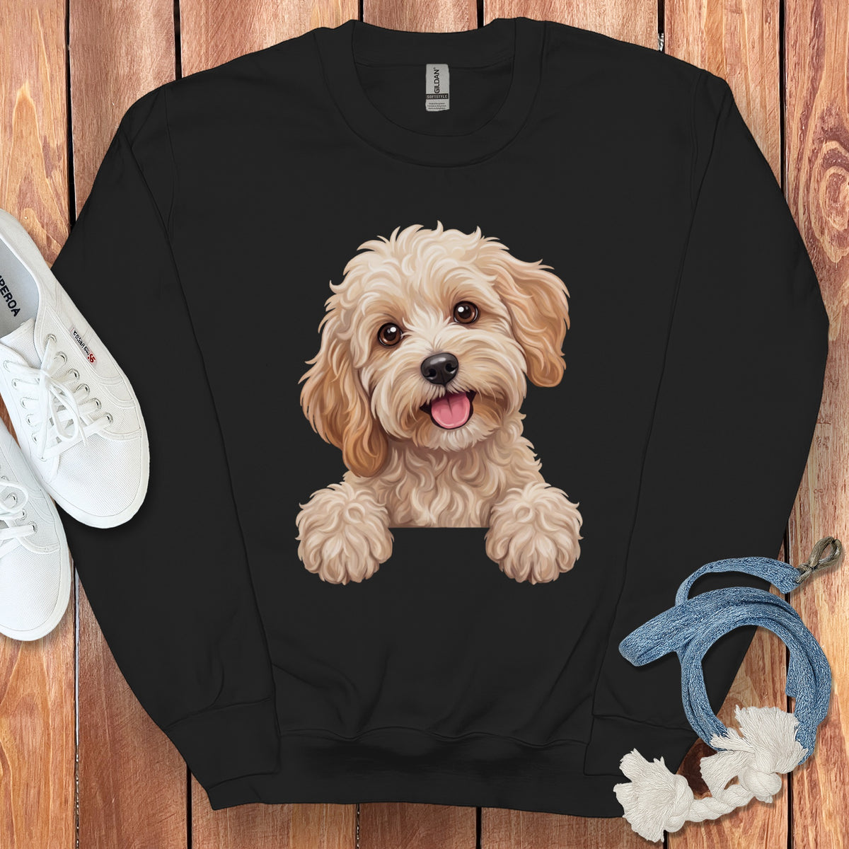 Black sweatshirt with a cartoon dog print and white sneakers.