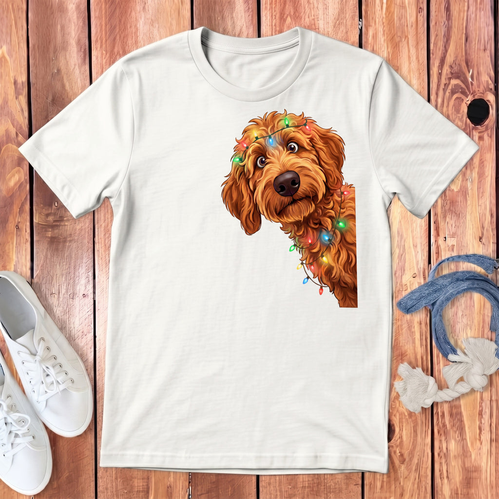White t-shirt with a brown dog peeking out, adorned with colorful Christmas lights.