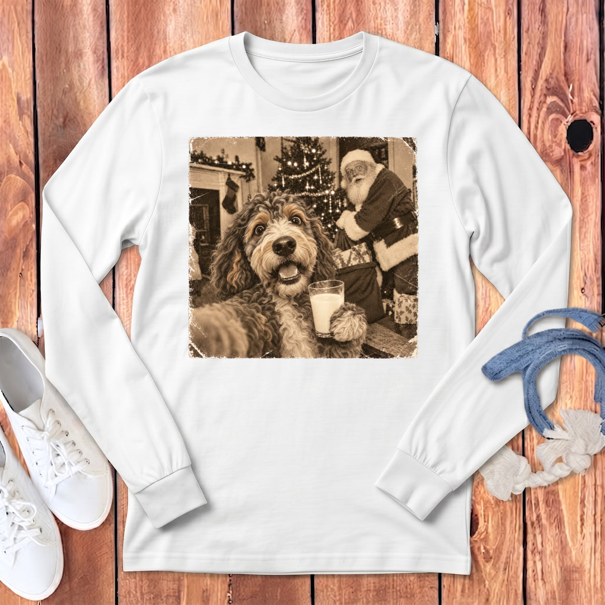 White long-sleeve t-shirt featuring a vintage sepia print of a dog holding a glass of milk with Santa in the background.