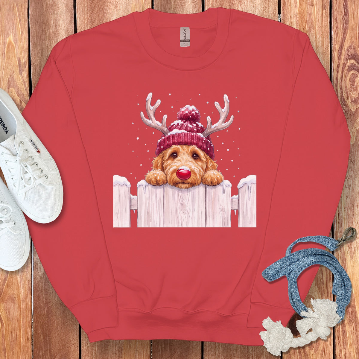 Red sweatshirt with a Christmas doodle dog wearing reindeer antlers and a beanie.