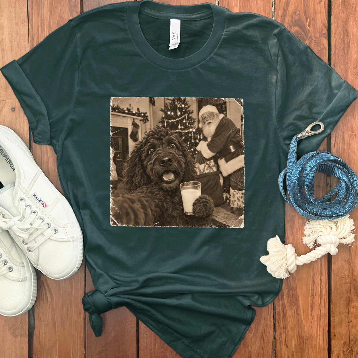 Dark green t-shirt featuring a vintage sepia print of a dog holding a glass of milk near Santa Claus.