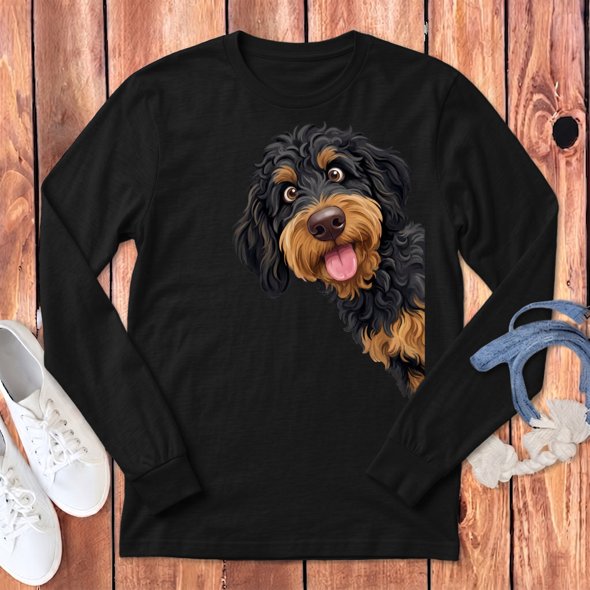 Black long-sleeve t-shirt with a doodle dog illustration peeking from the side.