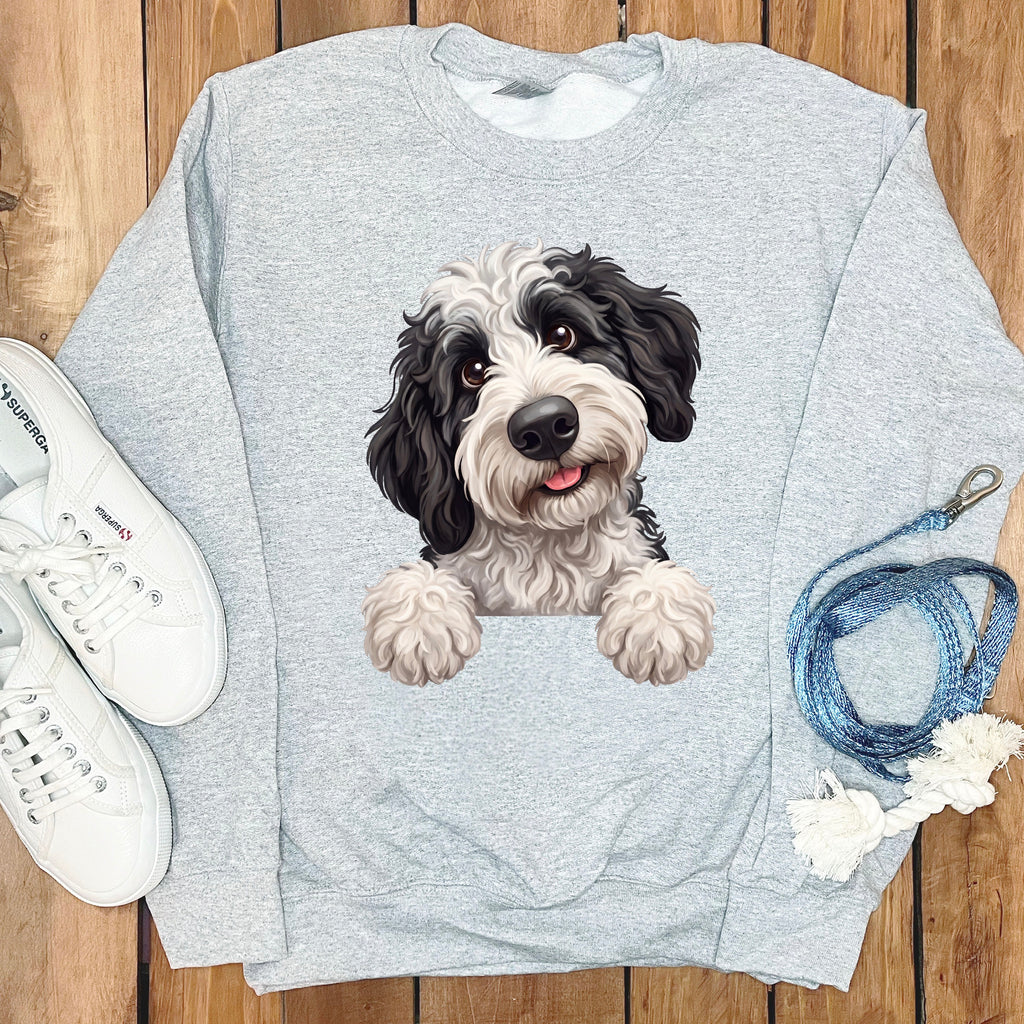 Grey sweatshirt with black and white dog graphic, white sneakers, and blue rope leash.