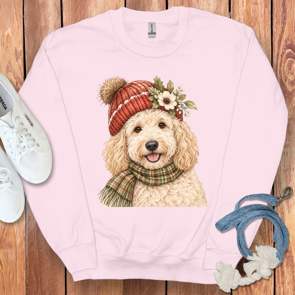 Pink sweatshirt with a watercolor illustration of a dog wearing a hat and scarf.