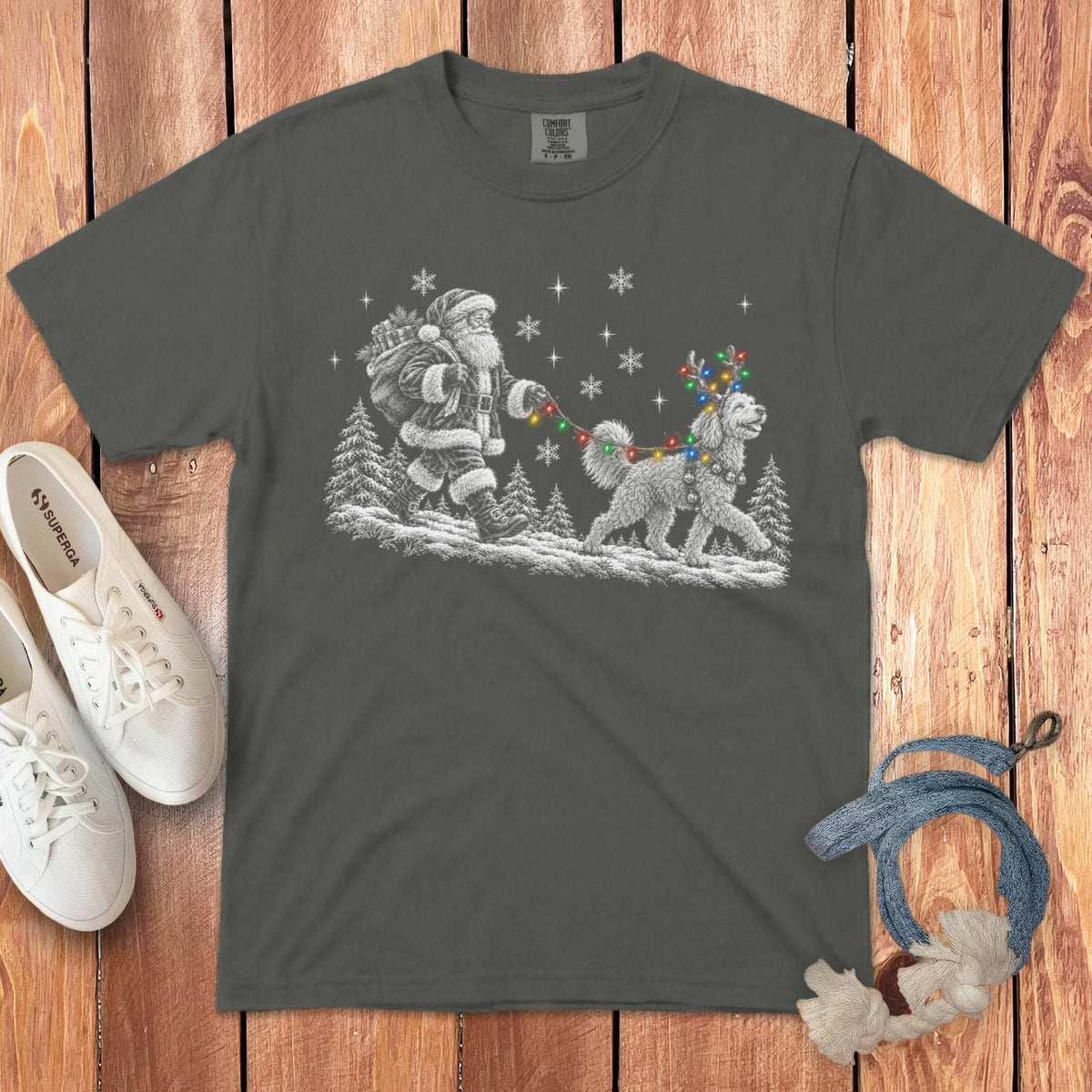 A dark gray t-shirt featuring a white illustration of Santa walking a dog wearing reindeer antlers and Christmas lights.