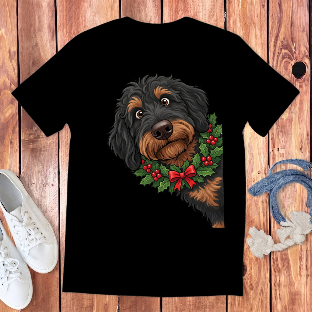 Black t-shirt with a drawing of a dog wearing a holly wreath and red bow.