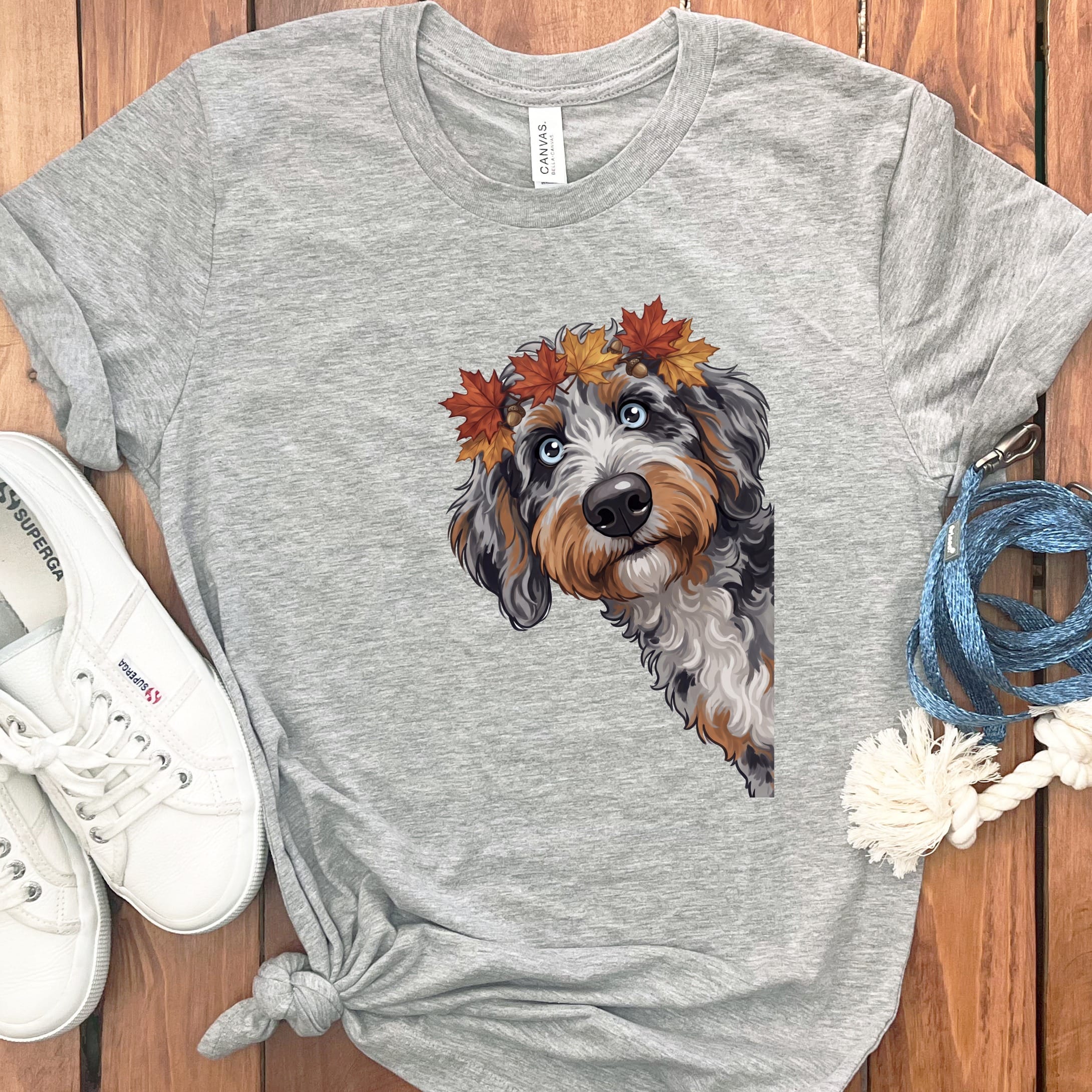 Grey t-shirt with a dog wearing a crown of autumn leaves.