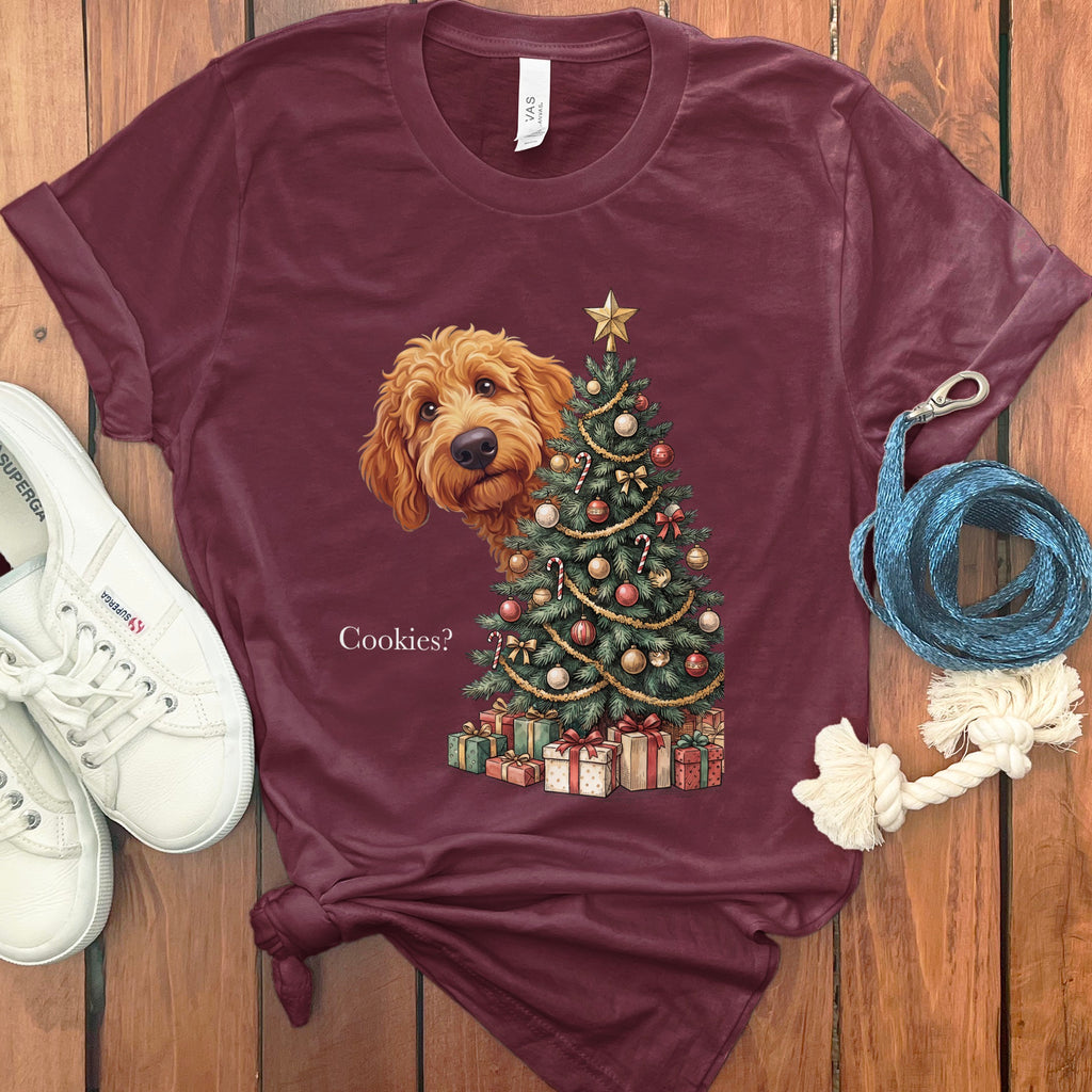 Goldendoodle peeking behind a decorated Christmas tree with gifts.