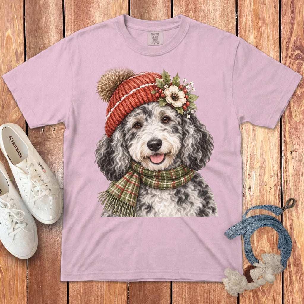 Pink t-shirt with a doodle dog wearing a winter hat and scarf.